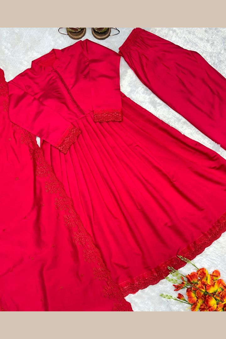 Premium women's Roman Silk party wear gown featuring heavy embroidery and full sleeves