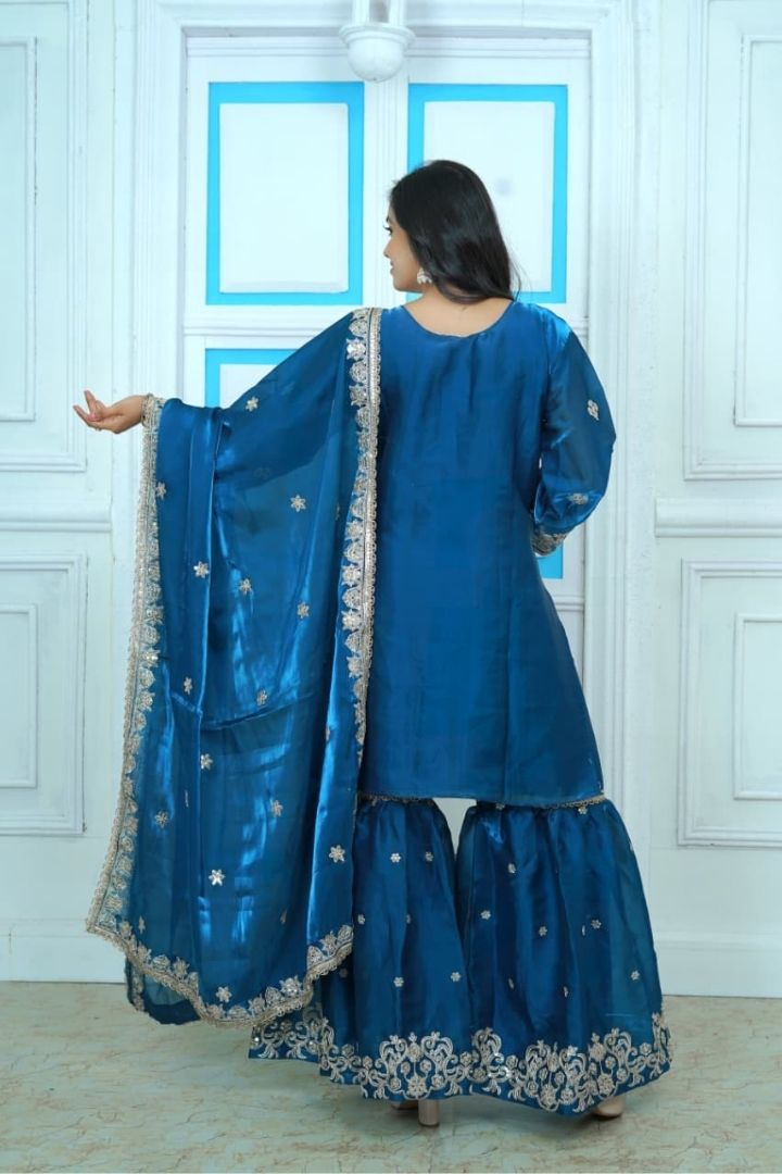 Women’s festive sharara suit with embroidered top and dupatta